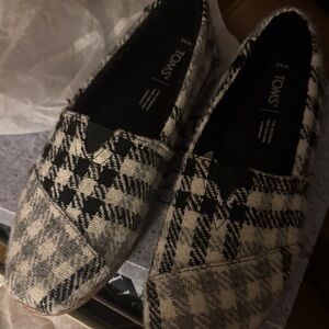 TOMS Black and Cream Checkered Slip-Ons